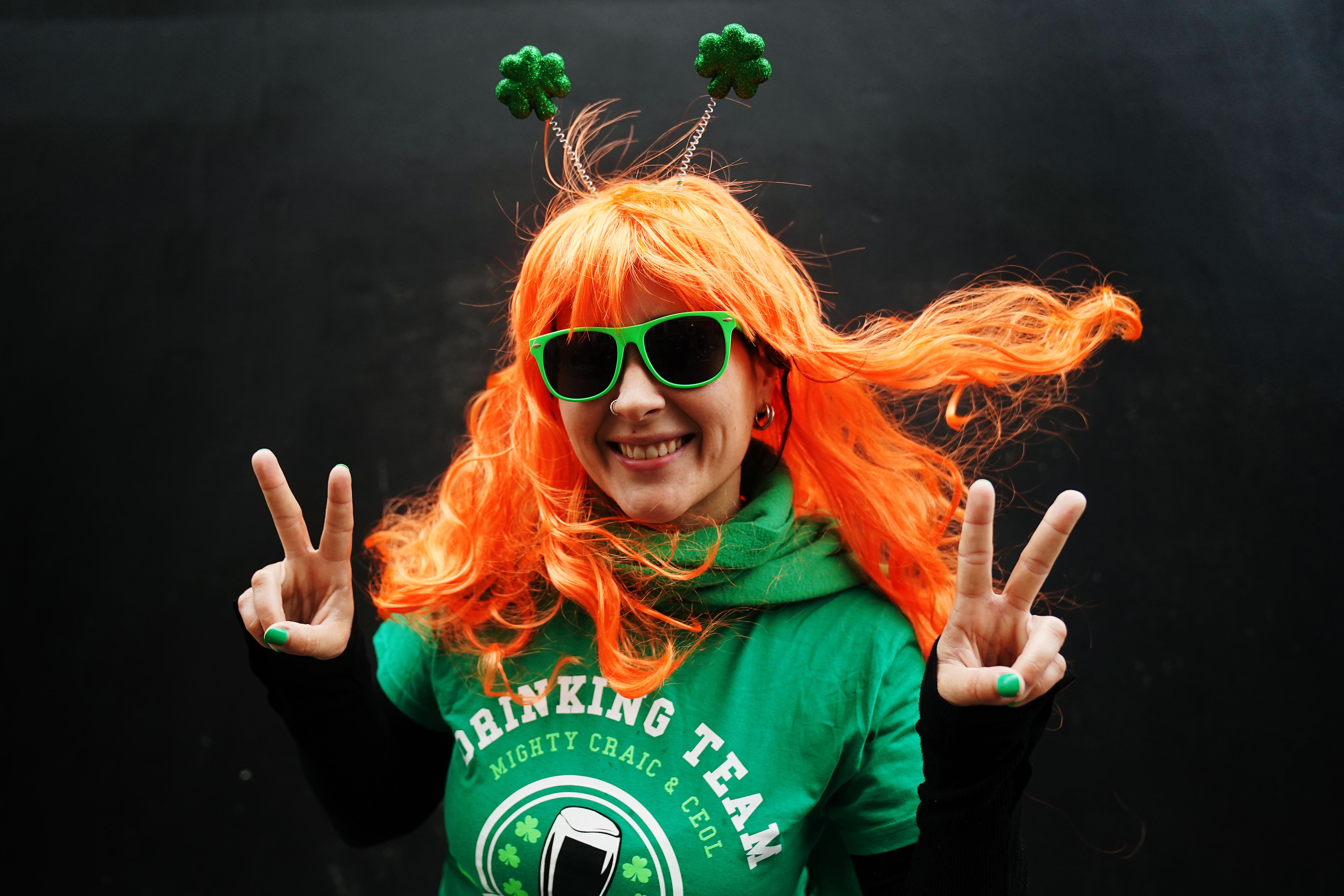 <p>A reveller at a St Patrick’s Day parade in 2023 (PA)</p>