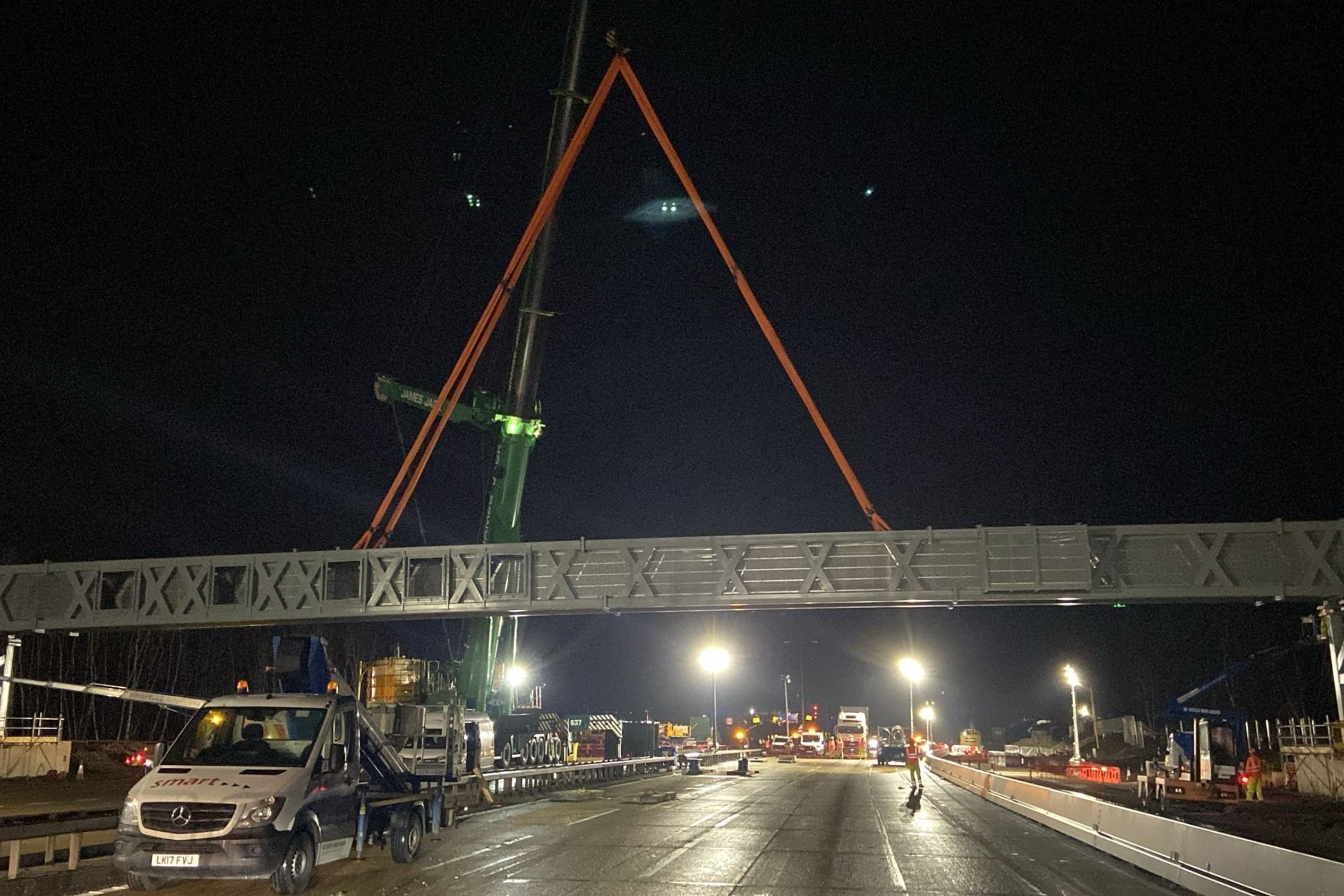 A gantry being installed overnight on a closed section of the M25 motorway in Surrey (National Highways South-East/PA)