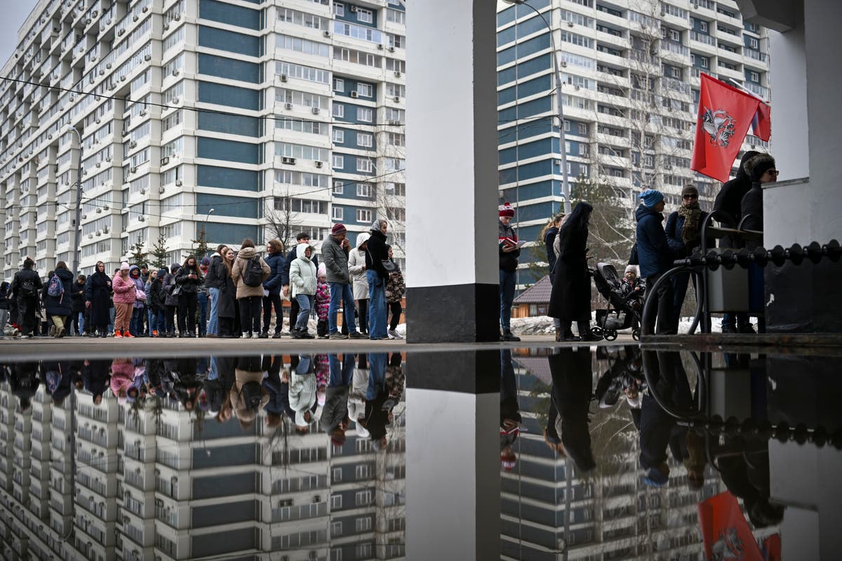 AP PHOTOS: Russians vote in election dominated by Putin