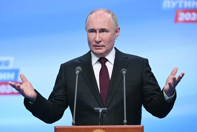 <p>Vladimir Putin delivers his victory speech at his campaign headquarters after winning the rigged presidential elections </p>