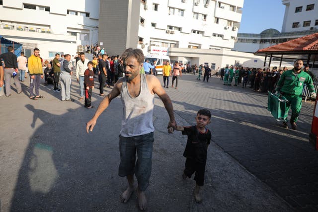 <p>File An injured Palestinian man and boy arrive to Al-Shifa Hospital in Gaza City following Israeli bombardment on 15 October 2023.</p>
