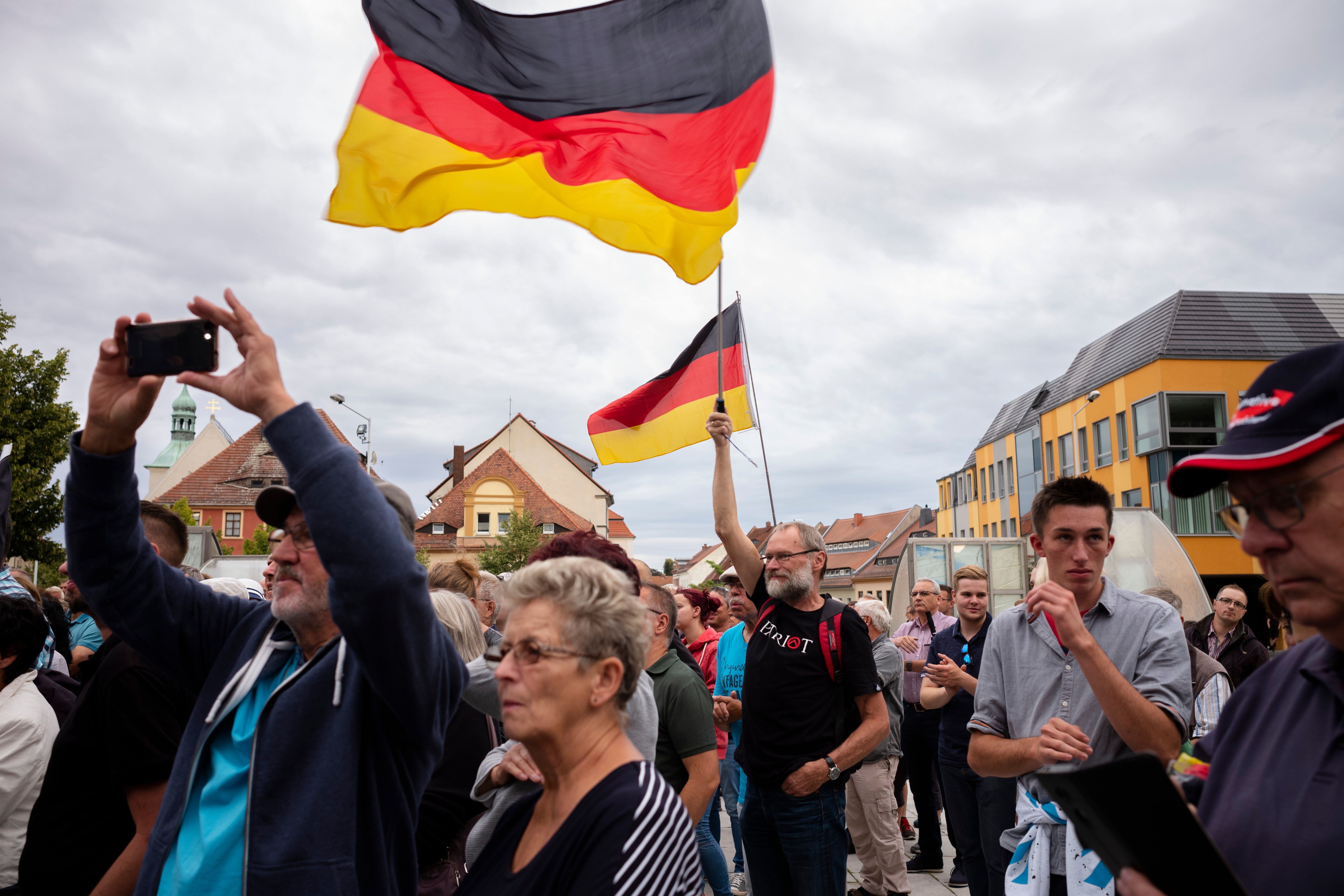 People attend an election rally of the far-right Alternative for Germany, or AfD, party for the Saxony state elections in Bautzen, Germany