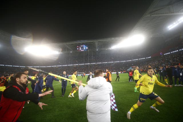 <p>Fenerbahce’s players are attacked by Trabzonspor supporters after the Turkey Super Lig match</p>