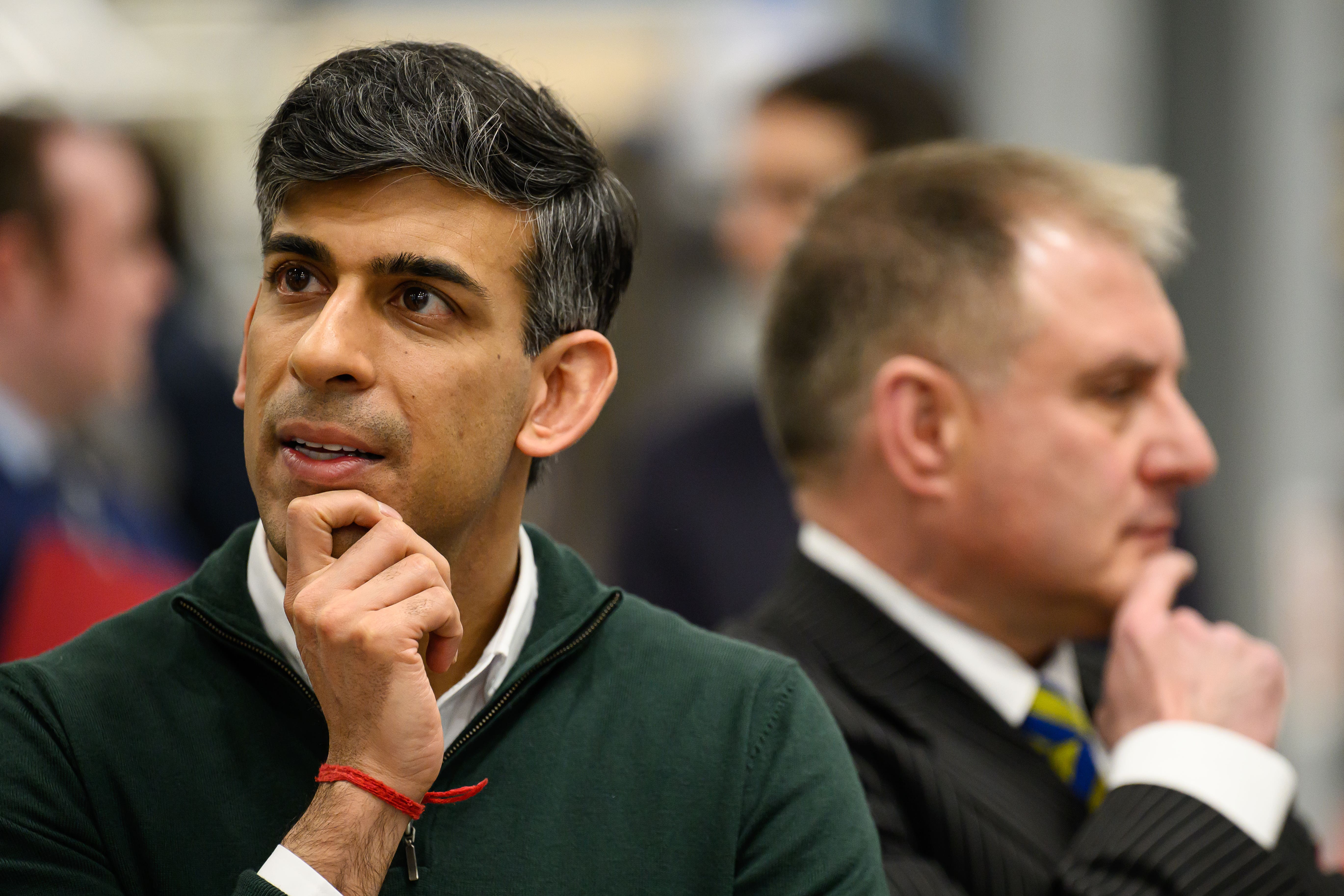 Prime Minister Rishi Sunak (left) and Conservative MP for Filton and Bradley Stoke Jack Lopresti listen to information on engine development during a visit to the Rolls-Royce manufacturing facility in Bristol (PA)