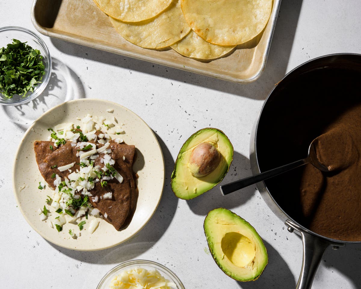 Turn a can of black beans into enfrijoladas, a saucy vegetarian supper