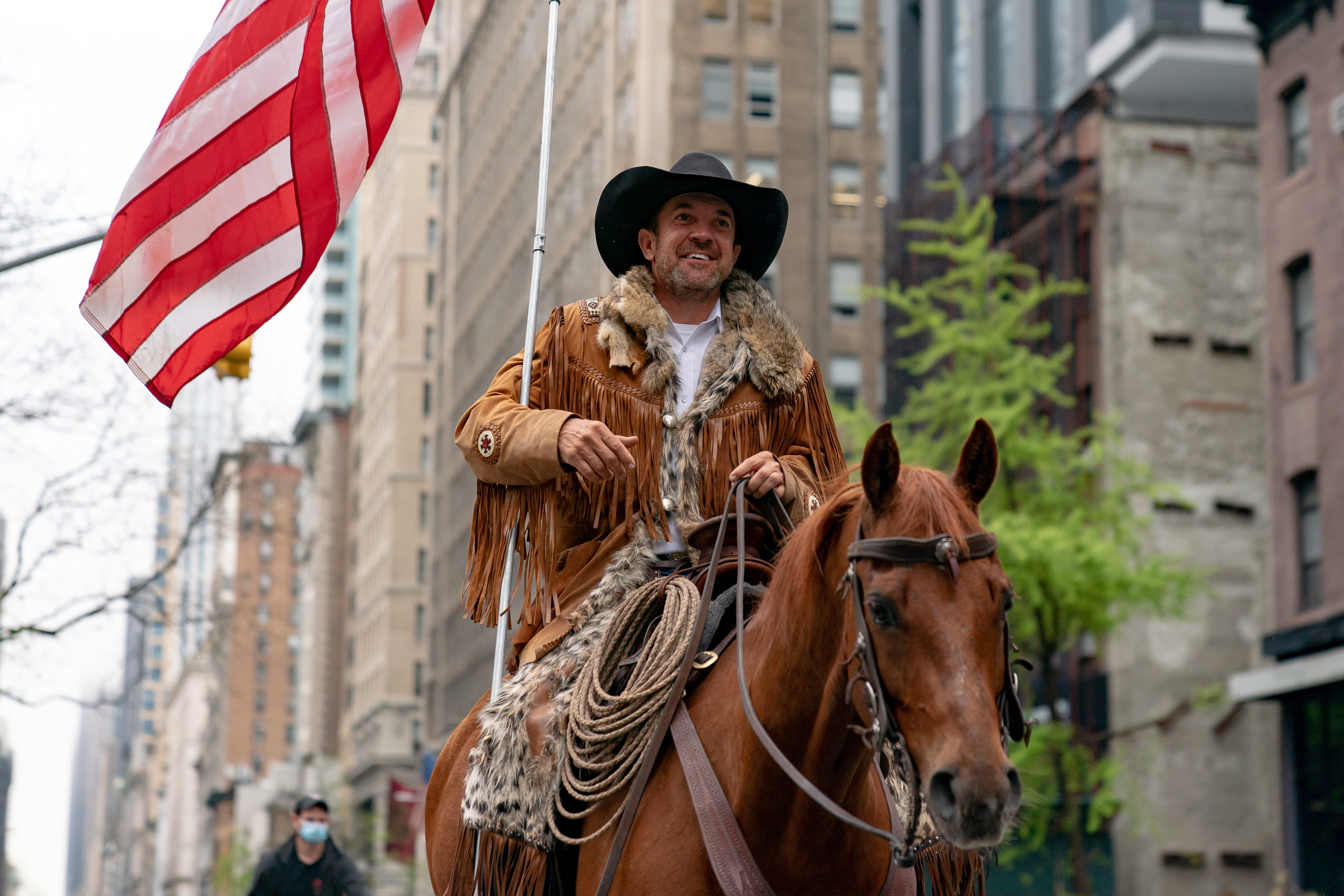 Now-former Otero County Commission chair and Cowboys for Trump co-founder Couy Griffin rides his horse on Fifth Avenue in New York on 1 May, 2020