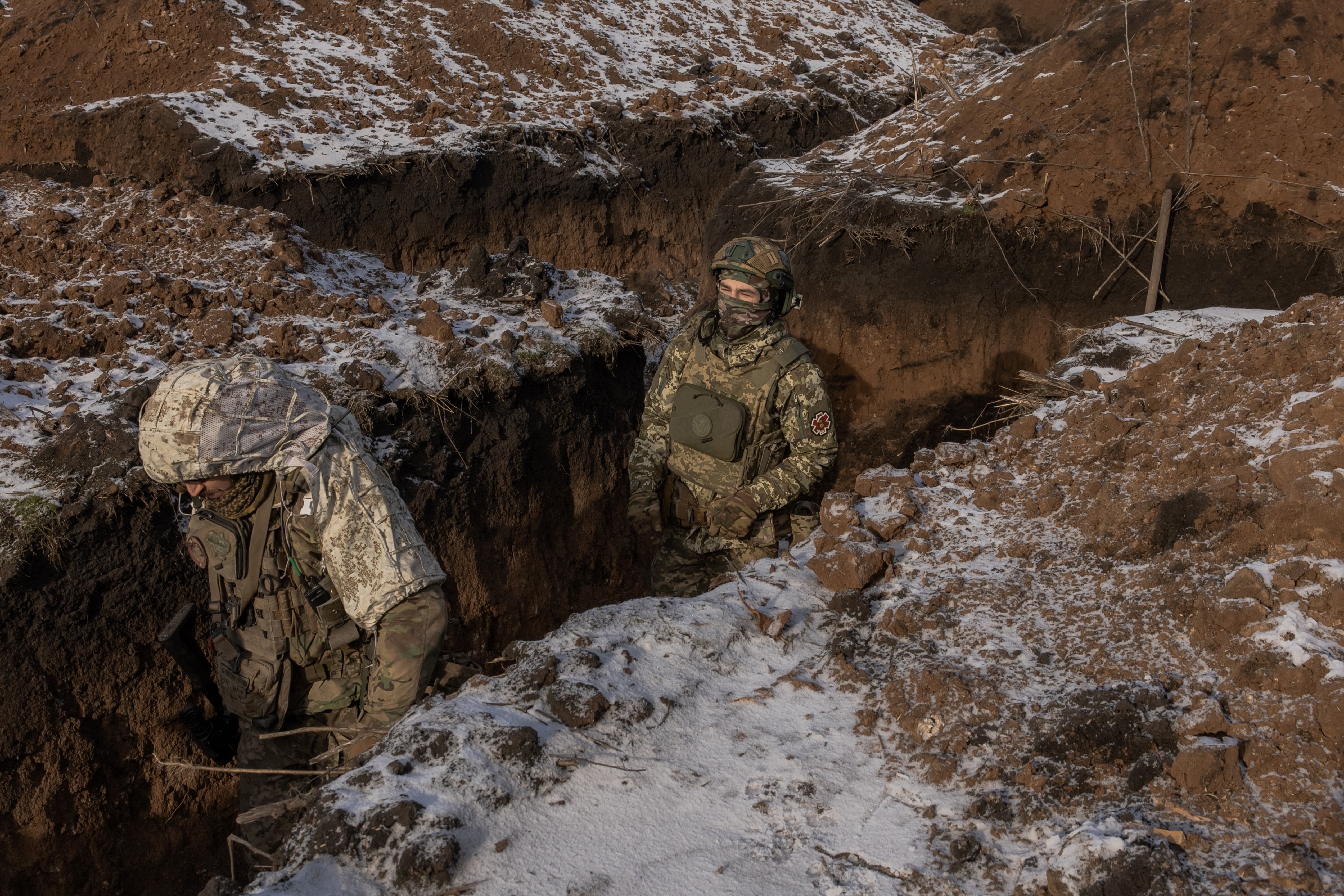 Ukrainian soldiers in one of the trenches around Kupiansk