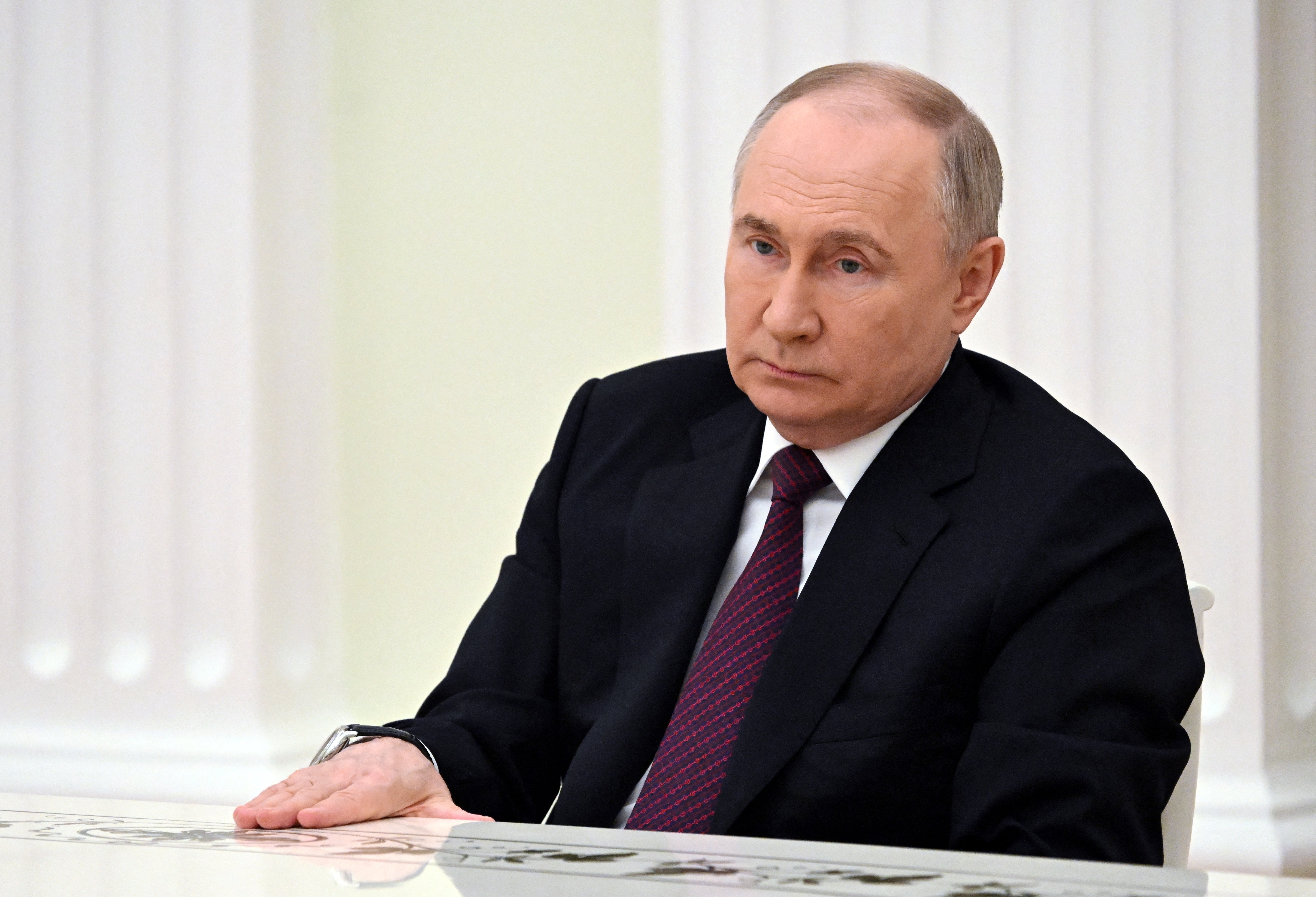 <p>Vladimir Putin at a meeting with defeated election candidates in Moscow on 18 March </p>