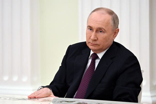 <p>Vladimir Putin at a meeting with defeated election candidates in Moscow on 18 March </p>