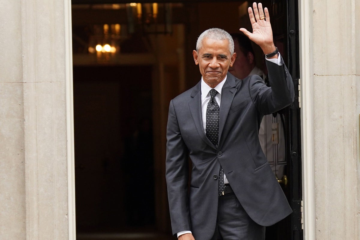 Barack Obama jokes with reporters as he leaves Downing Street after visiting Rishi Sunak