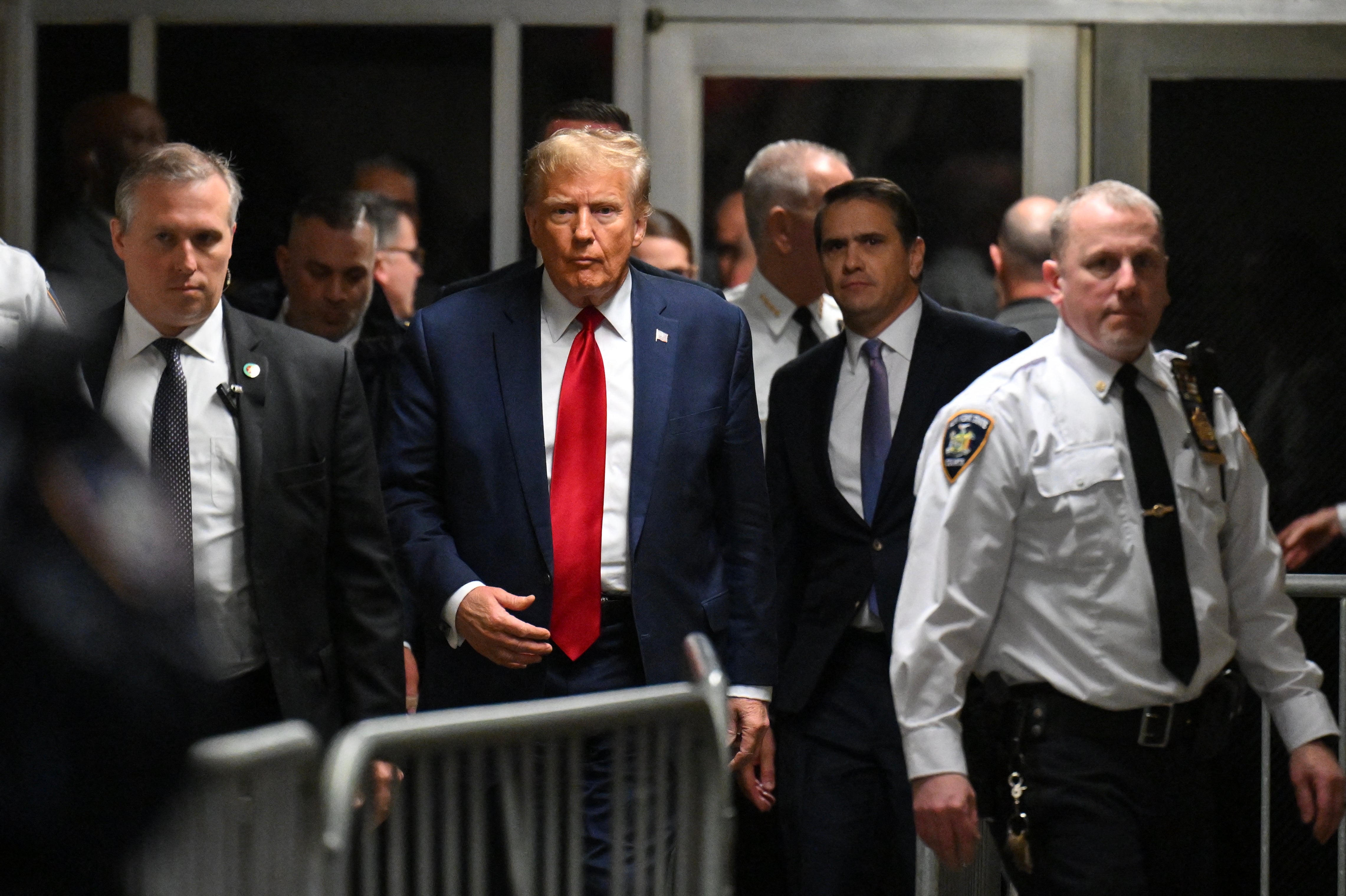 Donald Trump appears inside Manhattan criminal court for a pretrial hearing in his hush money case on 15 February