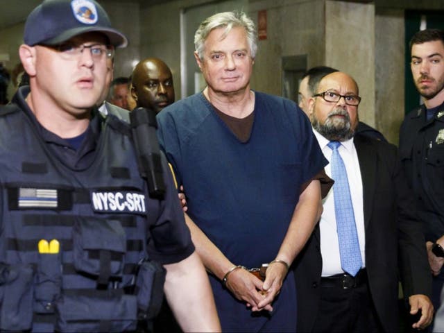 <p>Paul Manafort is escorted from a New York courtroom in June 2019</p>