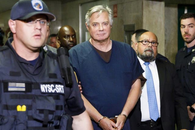<p>Paul Manafort is escorted from a New York courtroom in June 2019</p>
