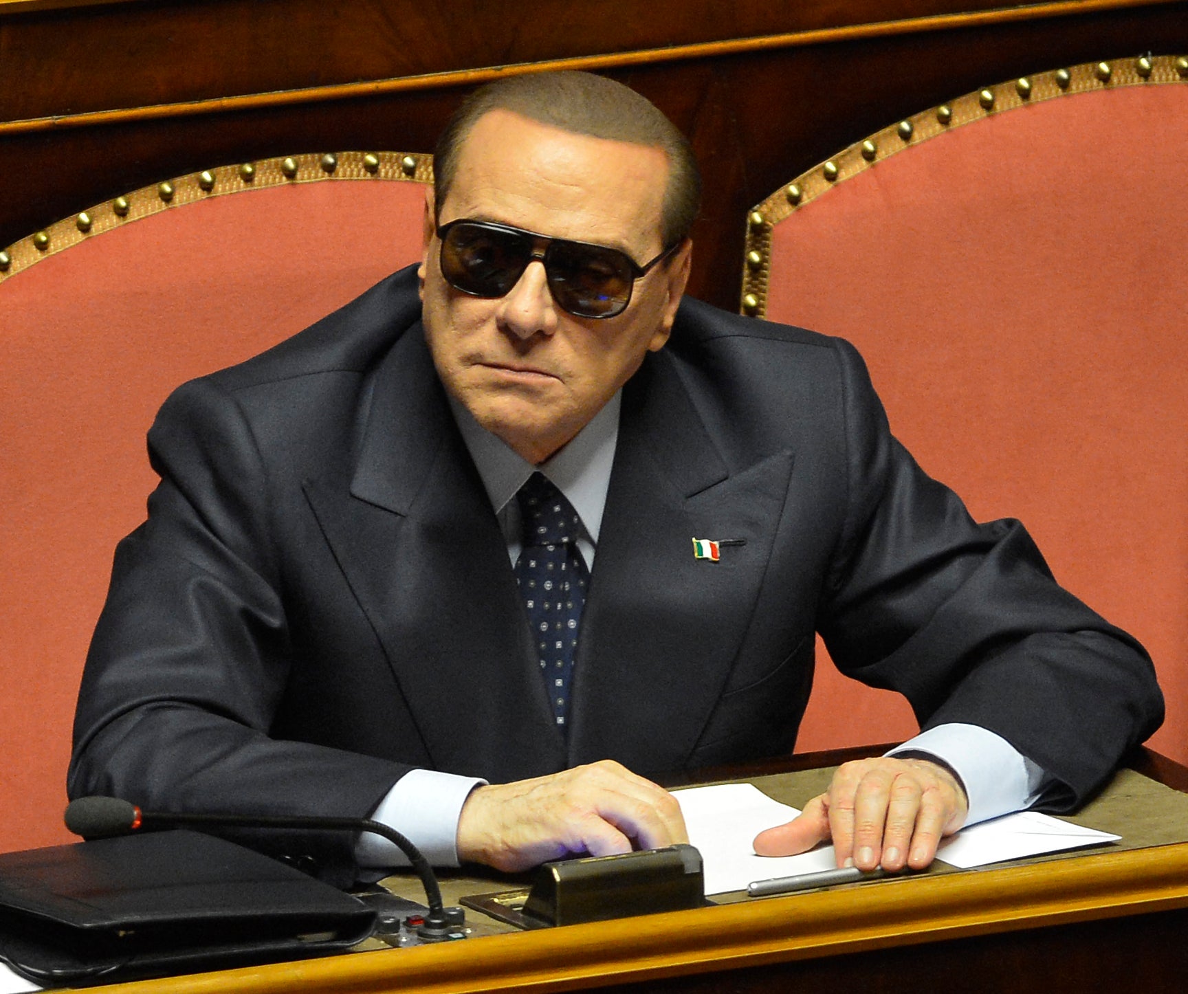 March 2013: Italy’s billionaire former Prime Minister Silvio Berlusconi is pictured at the Senate wearing sunglasses for medical reason