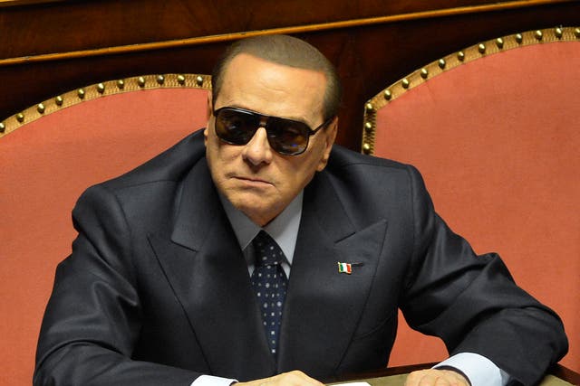 <p>March 2013: Italy’s billionaire former Prime Minister Silvio Berlusconi is pictured at the Senate wearing sunglasses for medical reason</p>