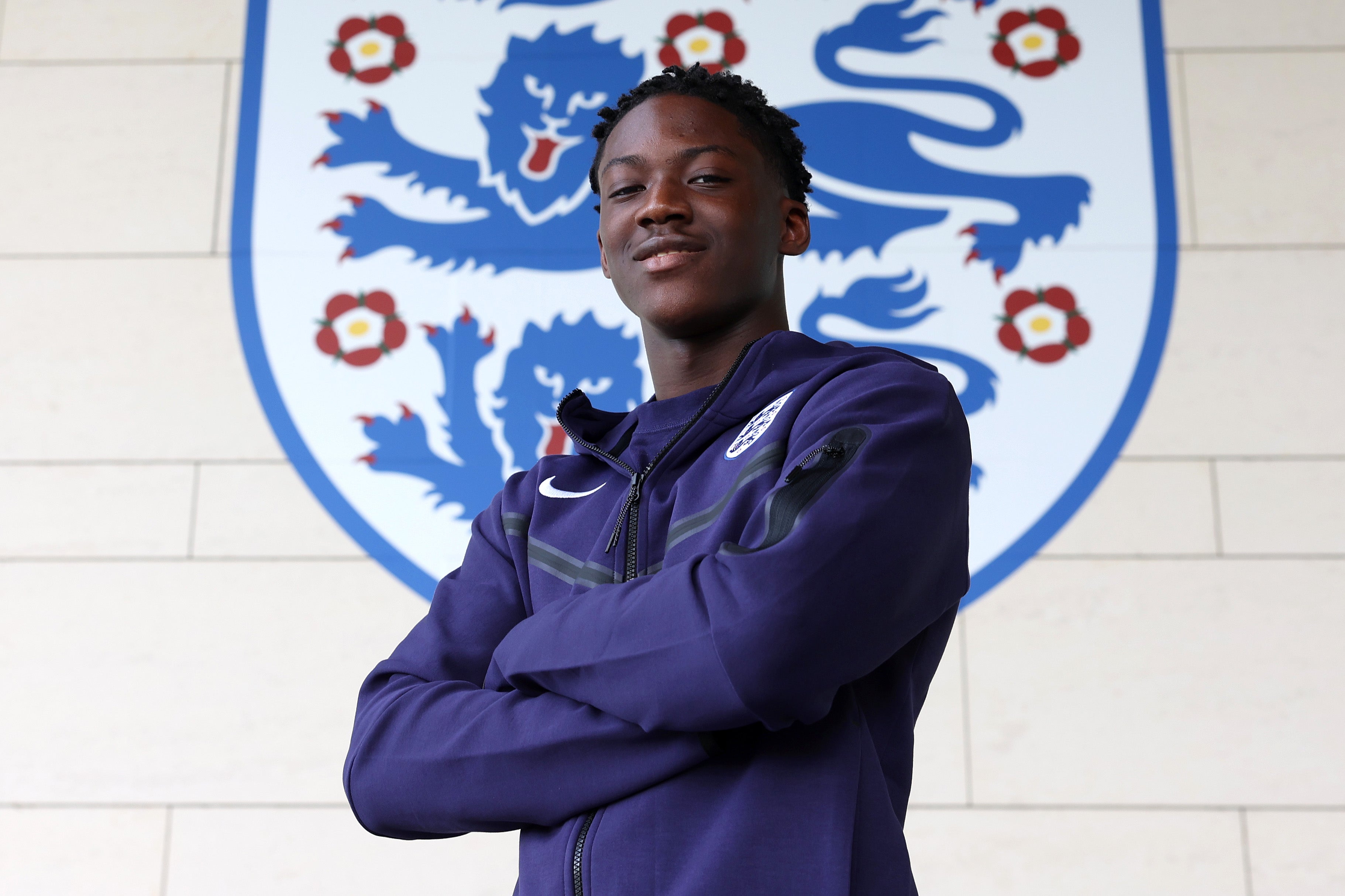 Kobbie Mainoo poses for photos at St George’s Park after his late call-up