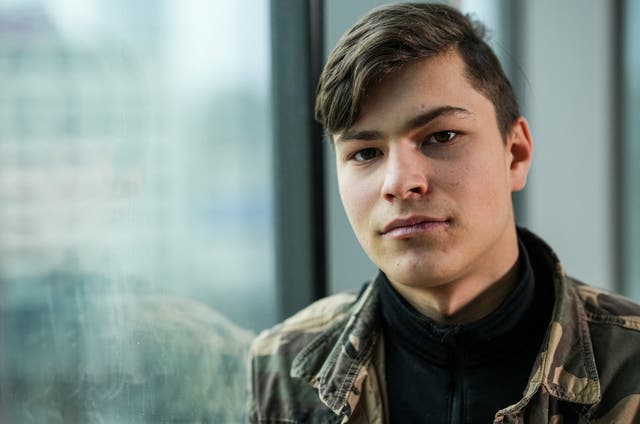 <p>Denys Kostev, a Ukrainian teen who lived in an orphanage in southern Ukraine and ended up in Russian-controlled territory following Moscow's full-scale invasion, poses for a portrait after an interview with Reuters in Warsaw, </p>