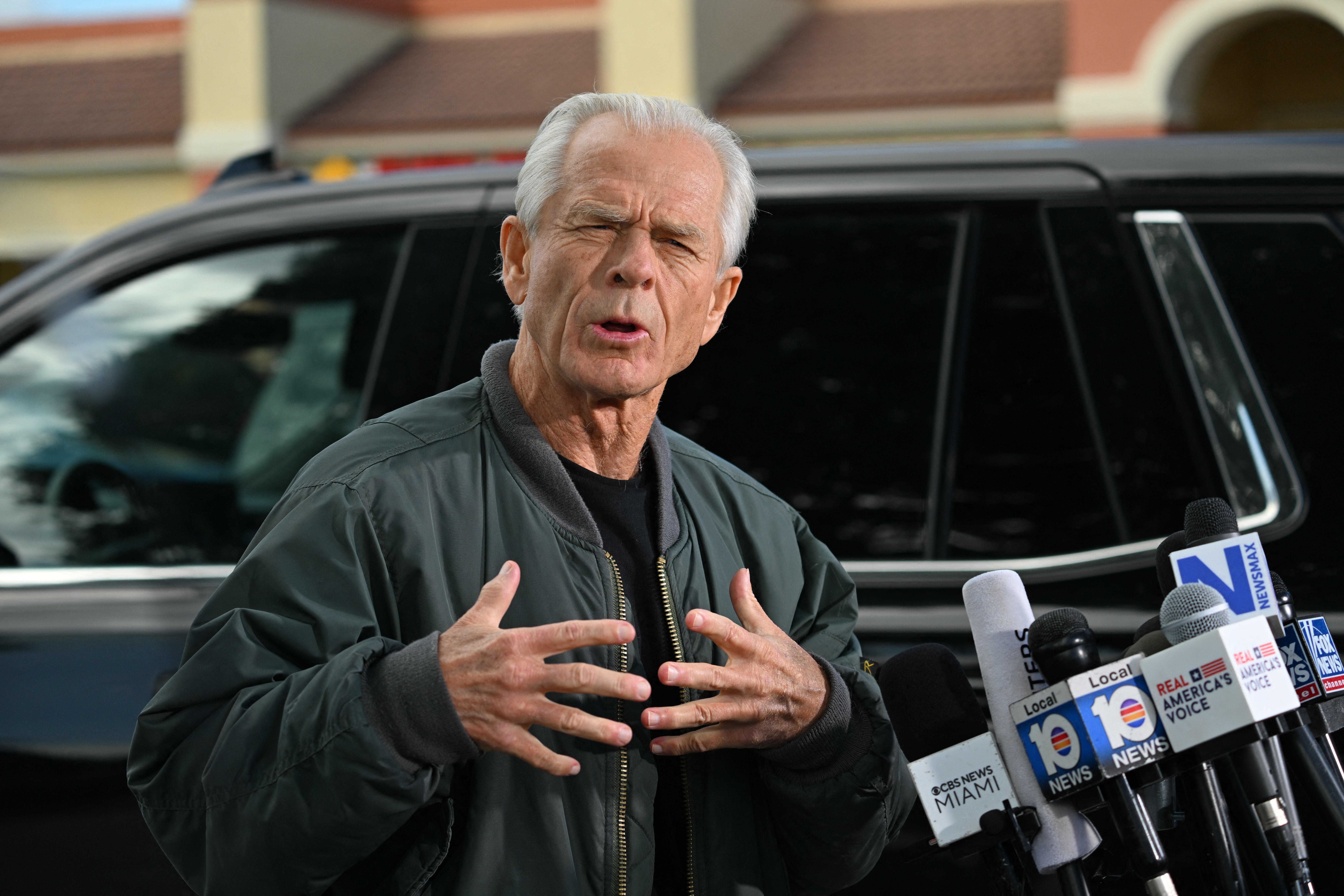 Peter Navarro, White House trade advisor to former US President Donald Trump, speaks to the press at the Country Mall Plaza before reporting to the Federal Correctional Institution, in Miami, Florida on 19 March 2024