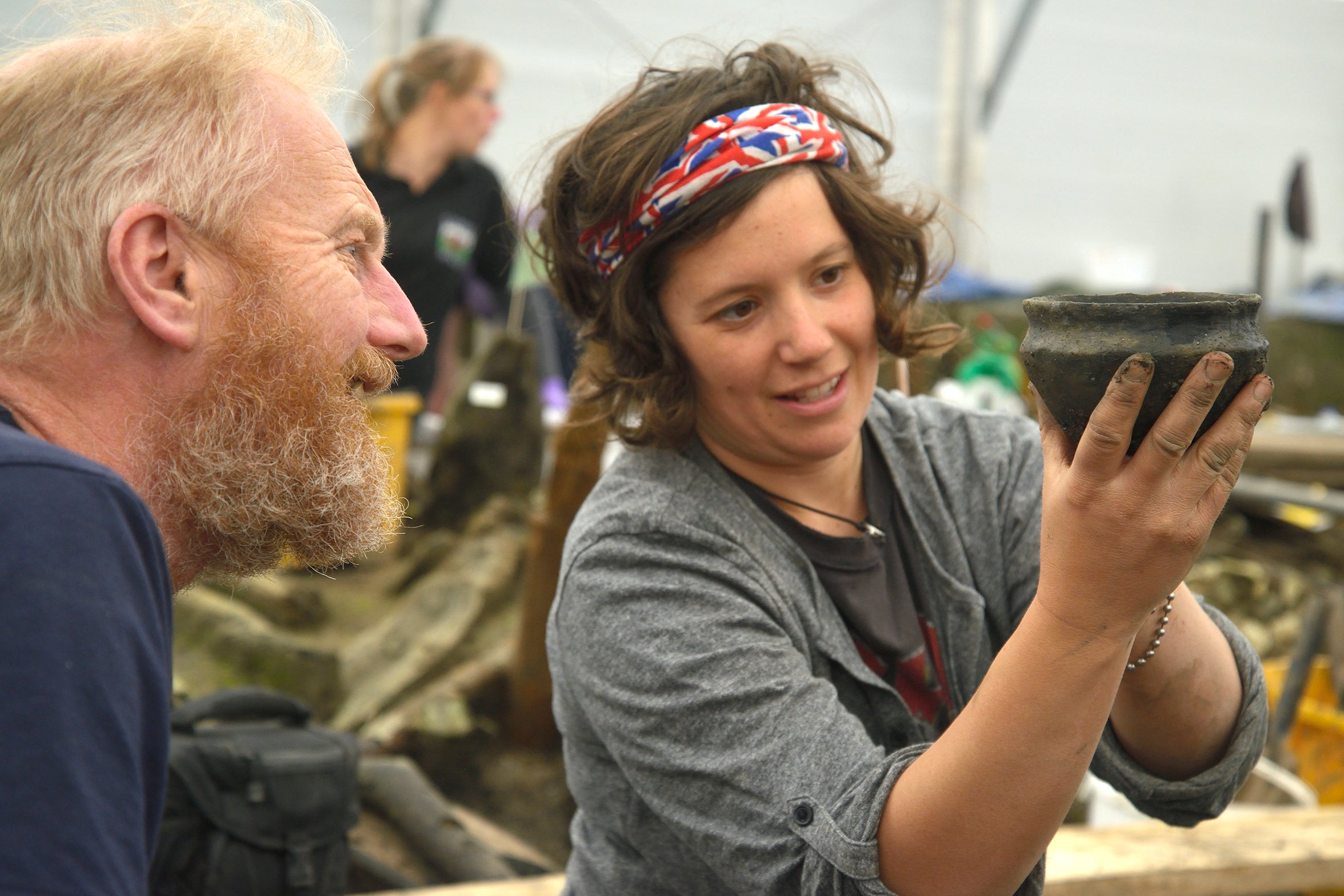 Archaeologists examining a Bronze Age bowl found at the Must Farm quarry