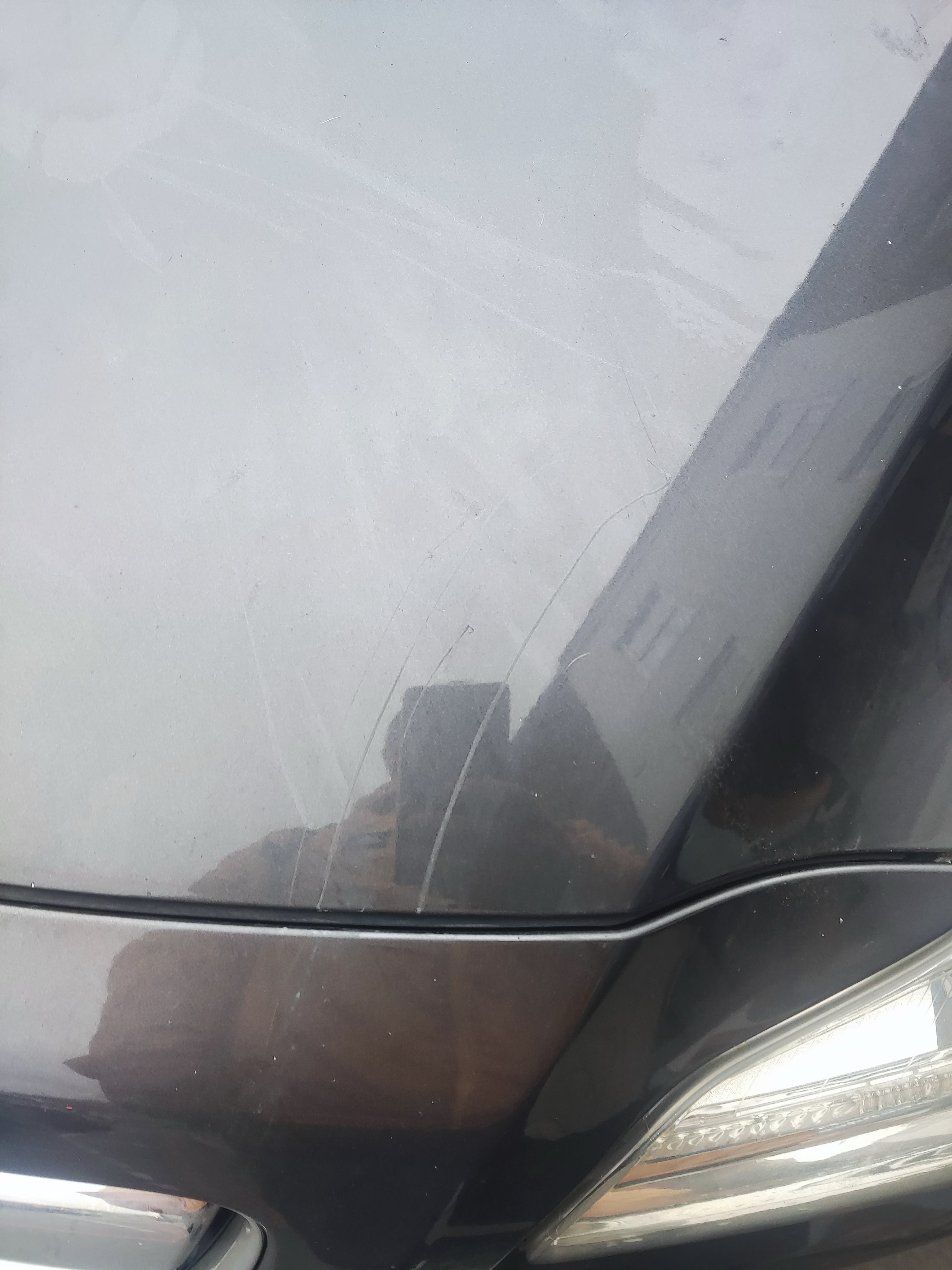 A car bonnet with scratches on it after the incident