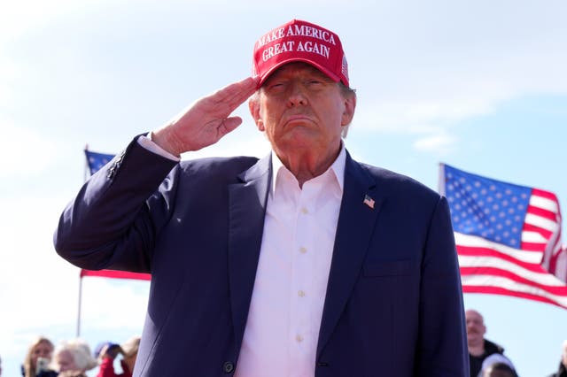 <p>Republican presidential candidate former President Donald Trump salutes at a campaign rally Saturday, March 16, 2024,</p>