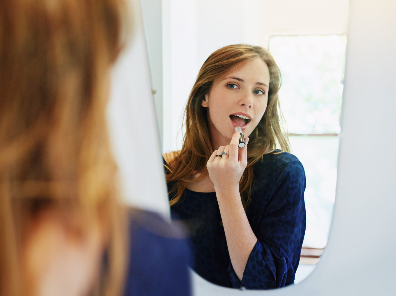 <p>A young woman getting ready for a date. </p>