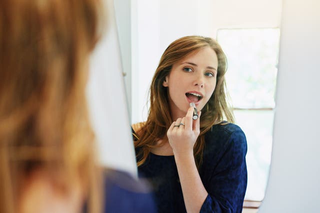 <p>A young woman getting ready for a date. </p>