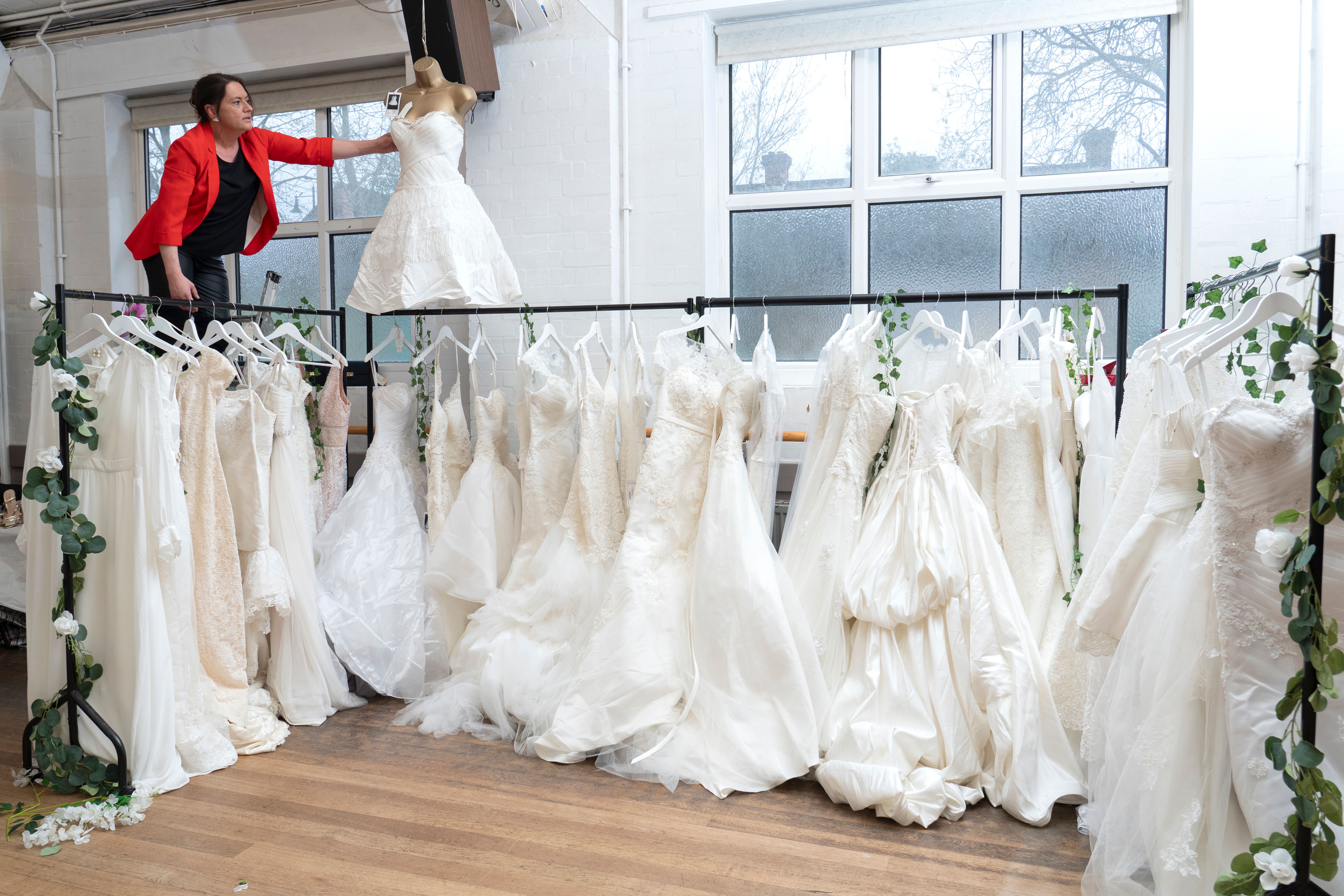 100 wedding dresses donated to charity shop in memory of late