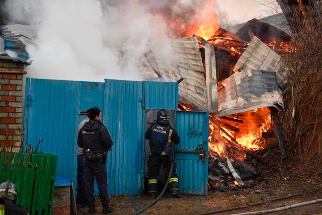 <p>This photo released by Belgorod region governor Vyacheslav Gladkov's telegram channel on Sunday, March 17, 2024, shows emergency employees working at a burning house after shelling from the Ukrainian side, in Belgorod, Russia</p>
