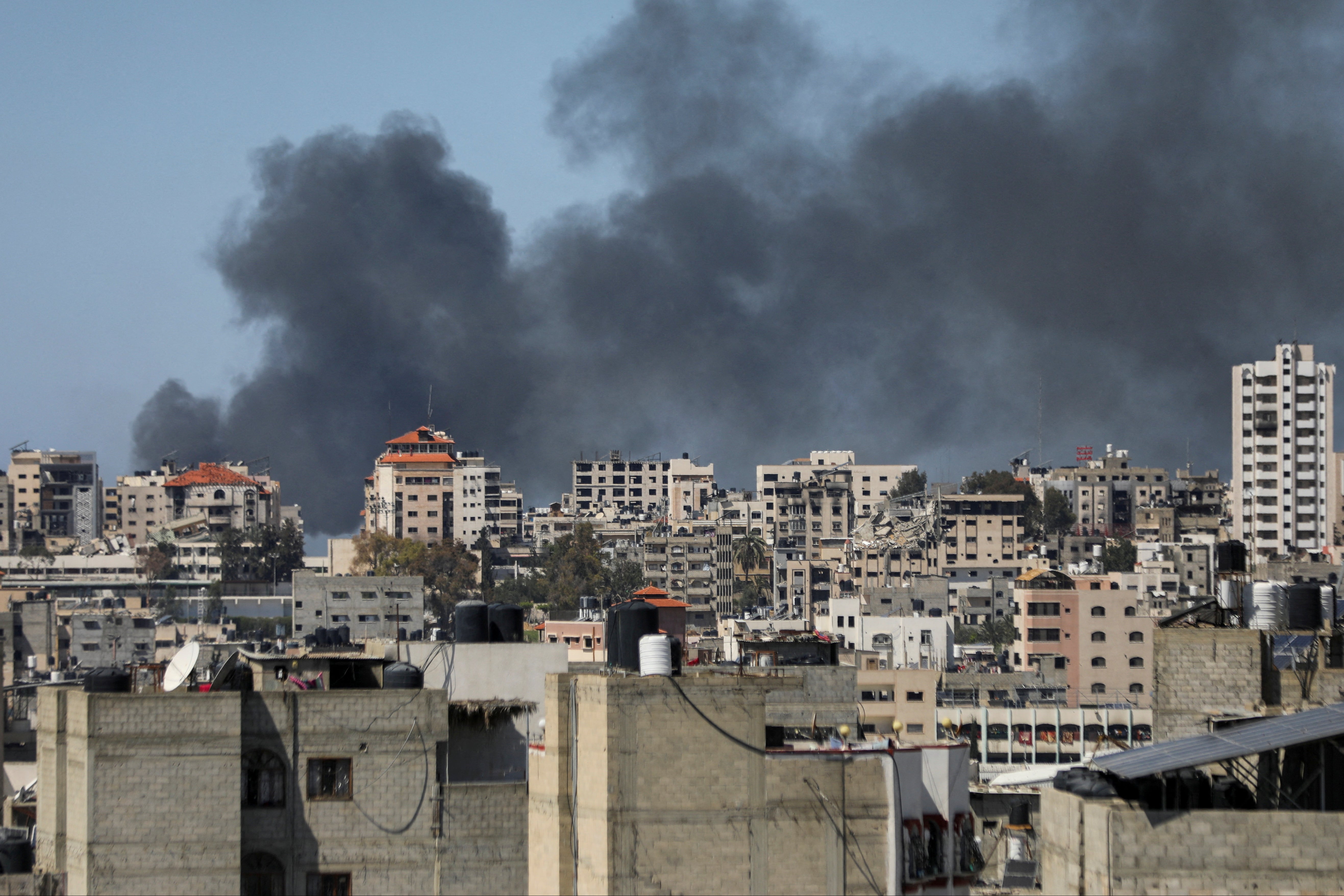 Smoke rises during an Israeli raid at Al Shifa Hospital and the area around it