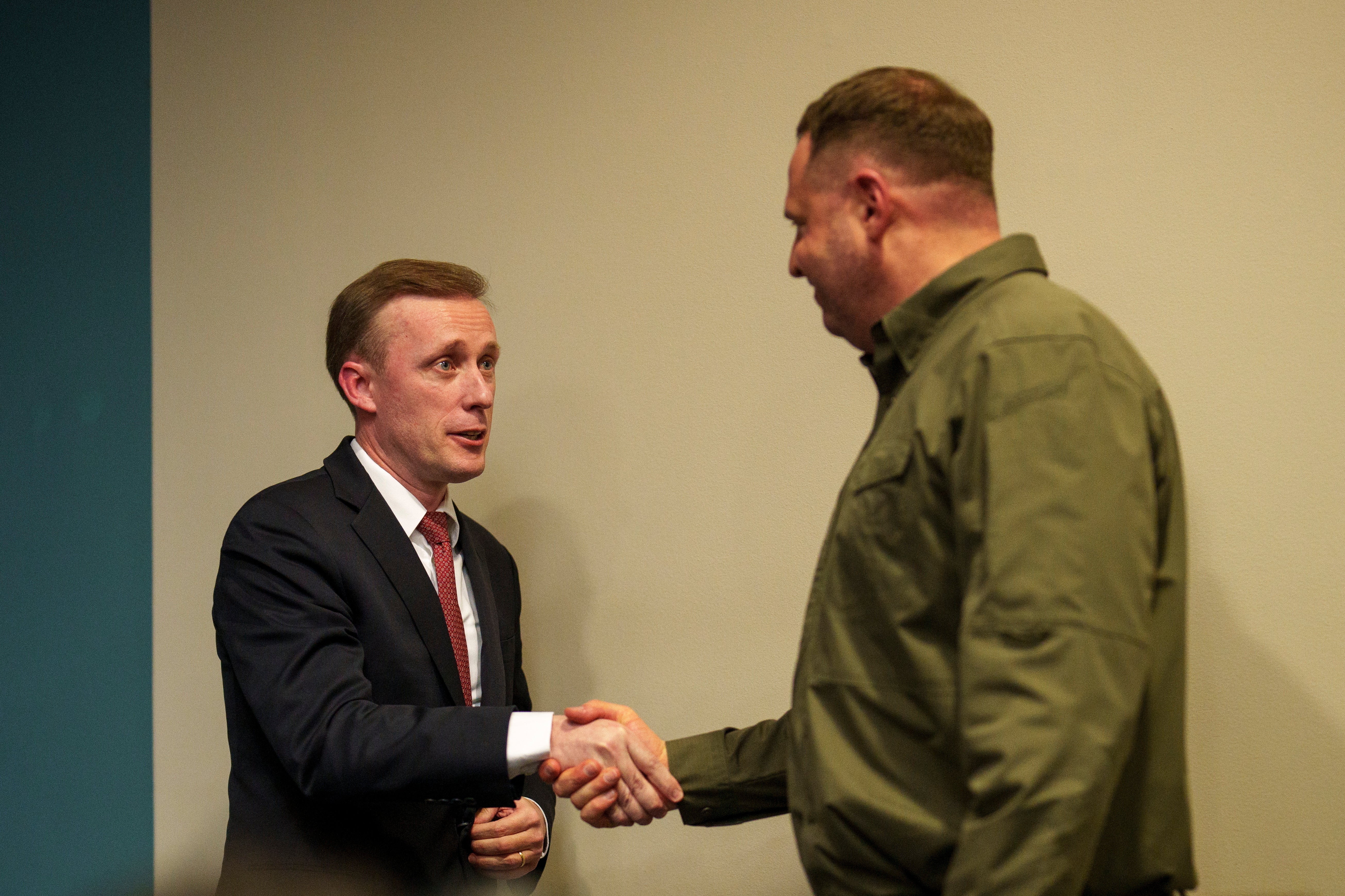 White House National Security Adviser Jake Sullivan, left, shakes hands with Andriy Yermak