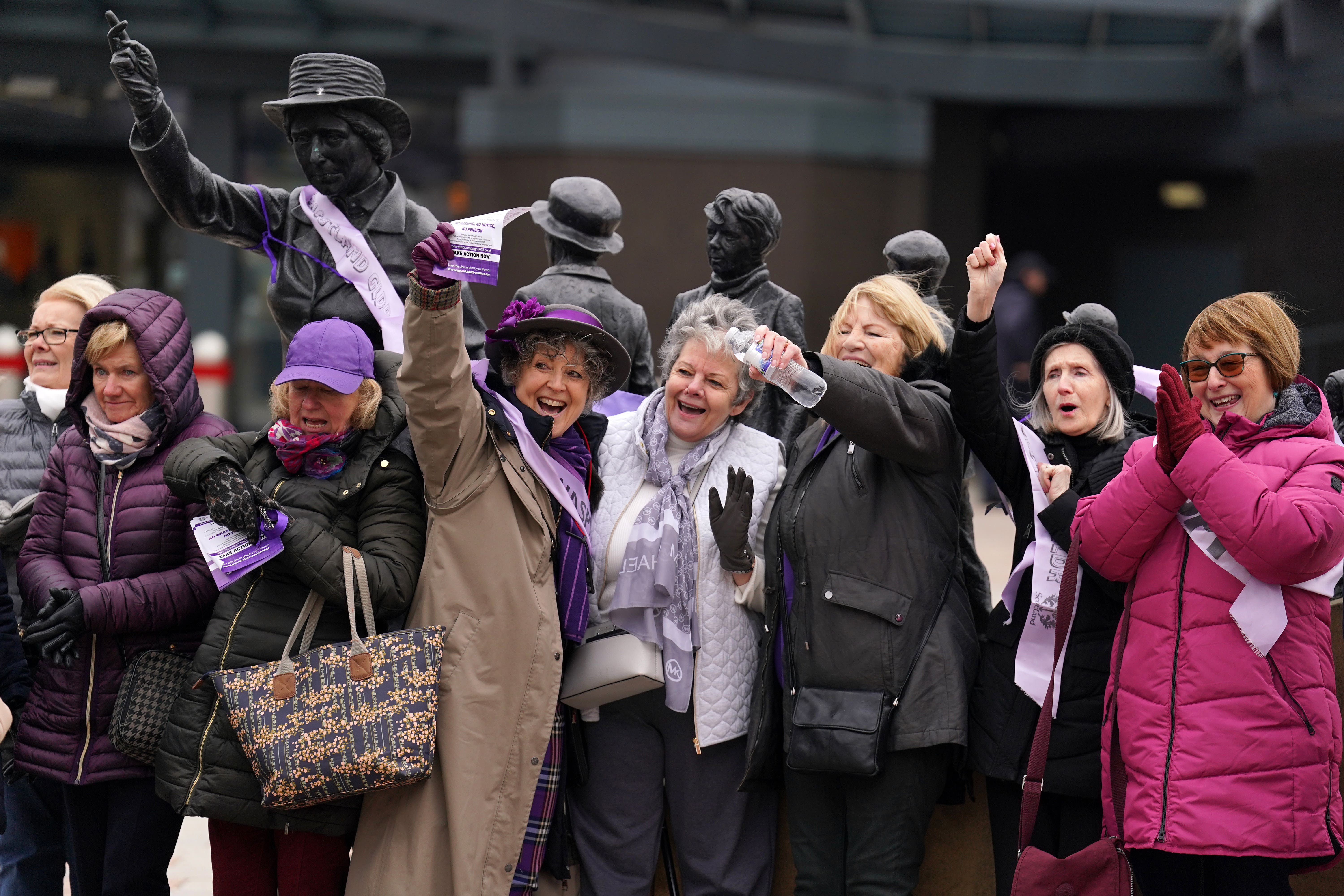 Women Against State Pension Inequality (Waspi) campaigners gather at the statue of political activist Mary Barbour