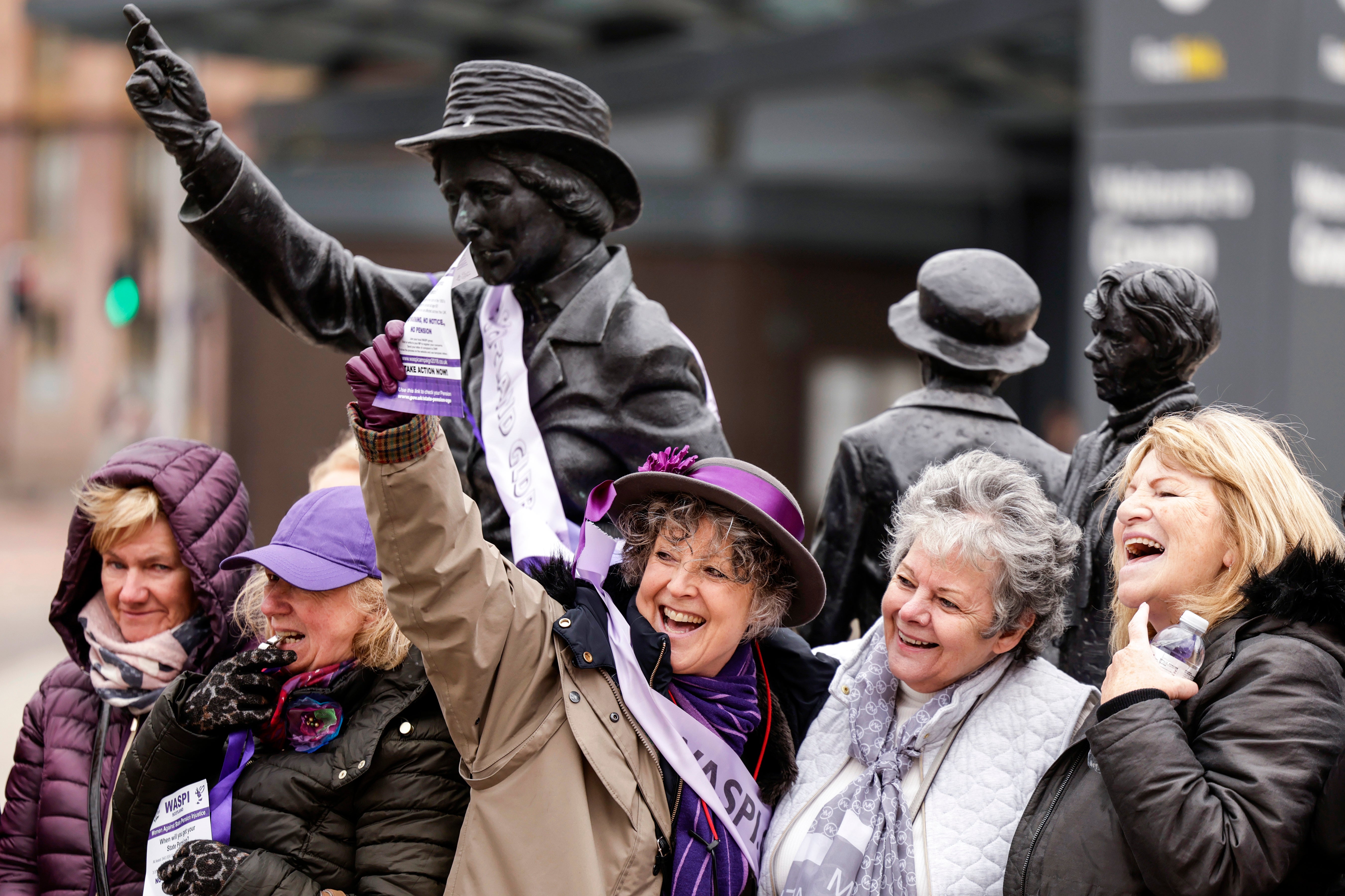 WASPI women gather at the statue of political activist Mary Barbour in Glasgow, 8 March
