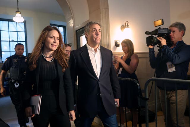 <p>Former President Donald Trump's former lawyer Michael Cohen and his attorney Danya Perry arrive at Trump's civil fraud trial at New York State Supreme Court on October 25, 2023 in New York City</p>