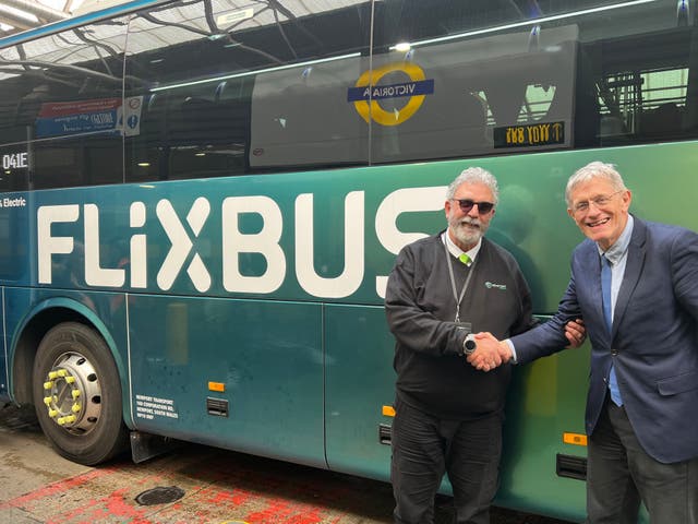 <p>Safe arrival: FlixBus driver Francesco (left) with Simon Calder</p>