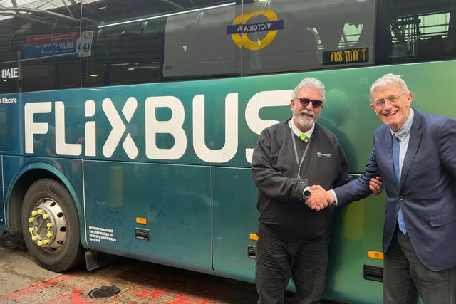 <p>Safe arrival: FlixBus driver Francesco (left) with Simon Calder</p>