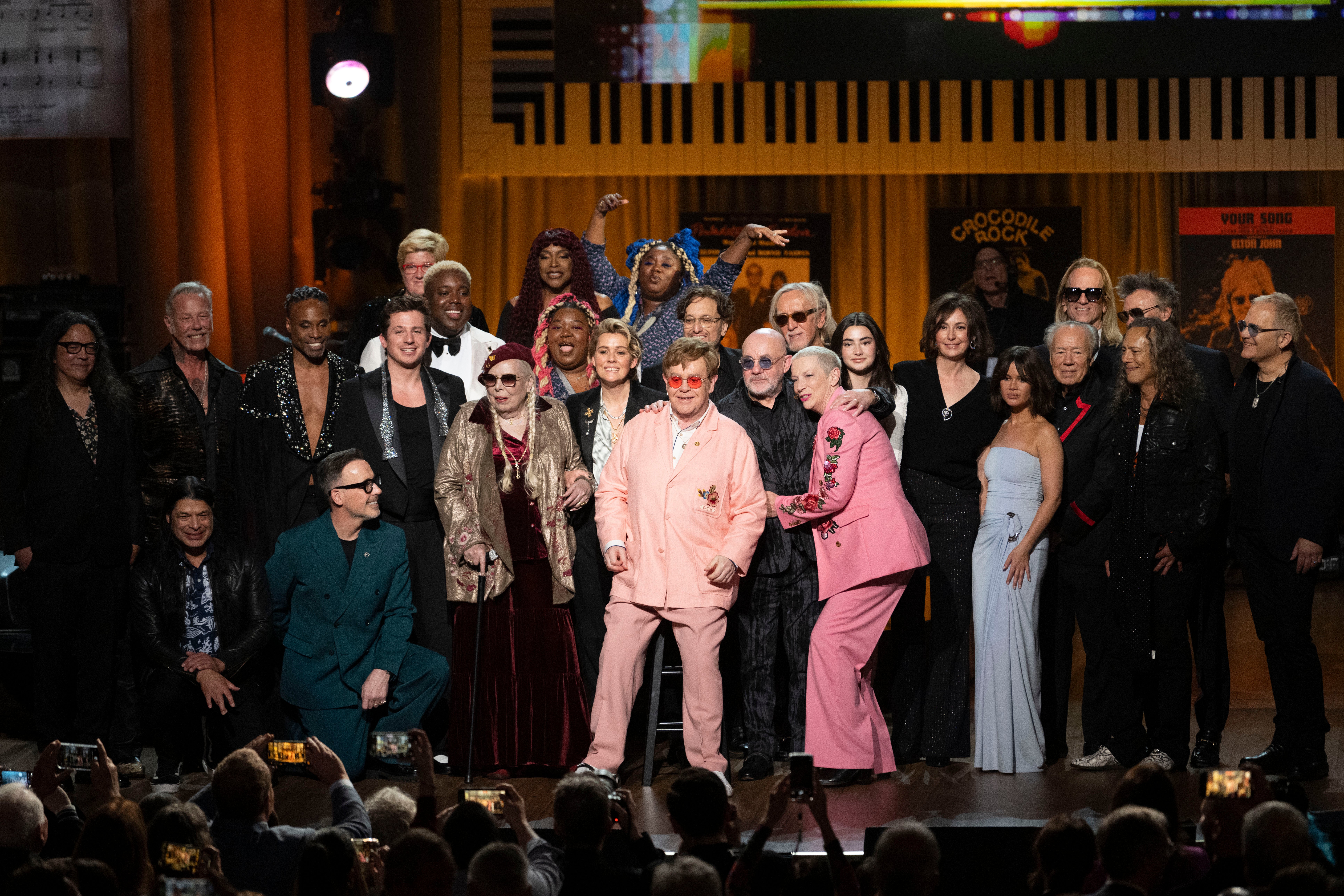 2024 Library of Congress Gershwin Prize for Popular Song honorees Elton John and Bernie Taupin are surrounded by the artists who performed in the Gershwin Prize tribute concert
