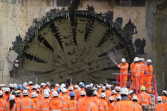 Champagne is sprayed after the boring machine Cecelia breaks through (Andrew Matthews/PA)