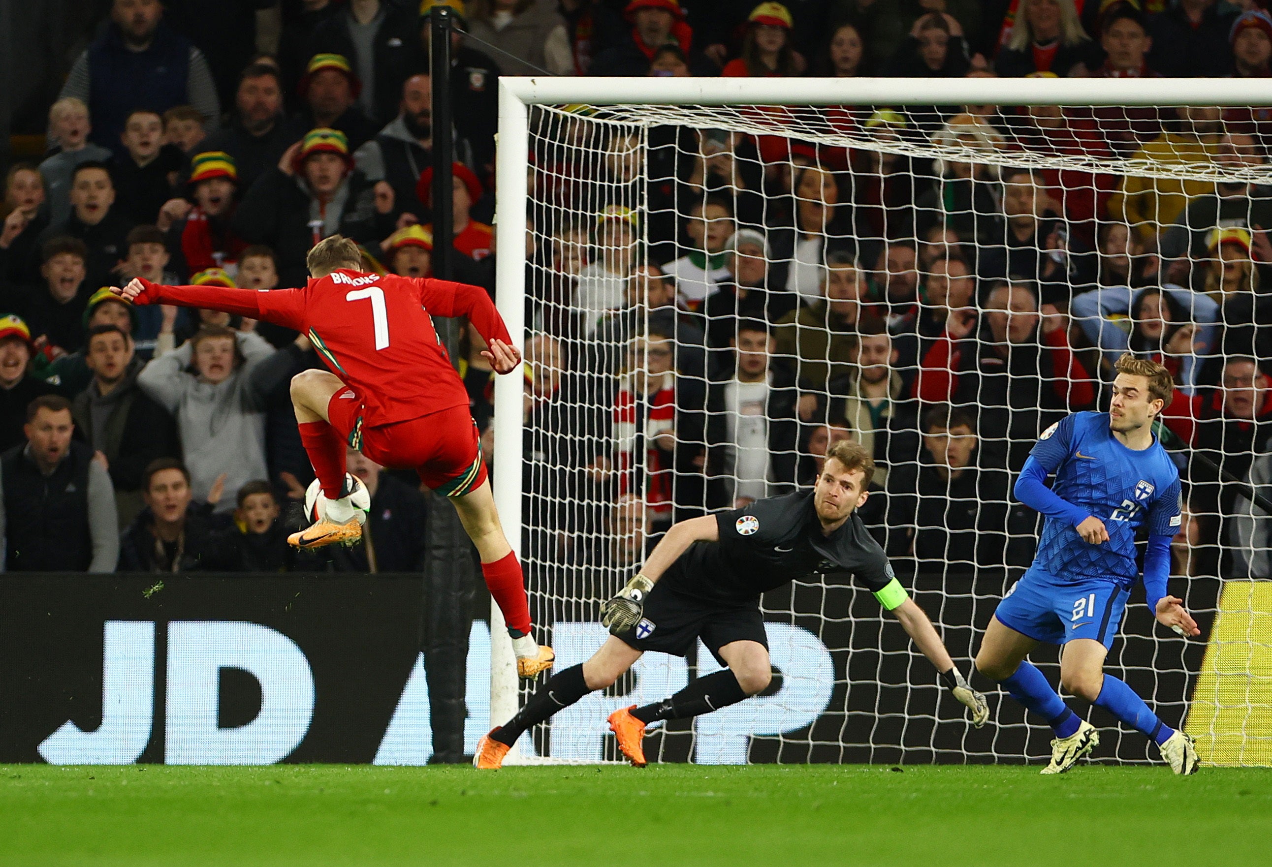 David Brooks leaps on to a rebound to put Wales in front