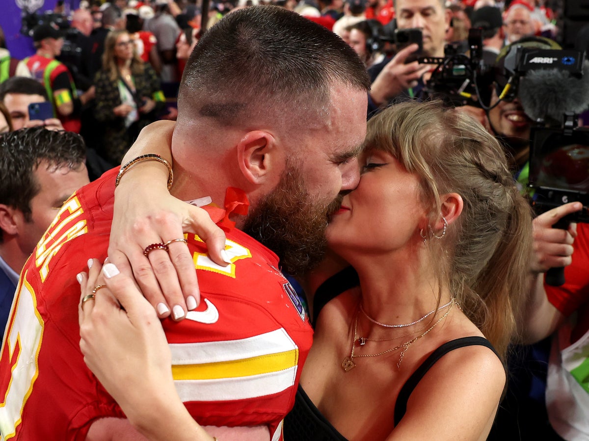 Viral video sees Travis Kelce planting kisses on Taylor Swift’s arm