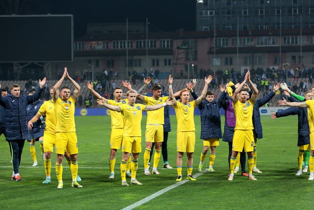 <p>Ukraine celebrate with their fans after beating Bosnia-Herzegovina</p>