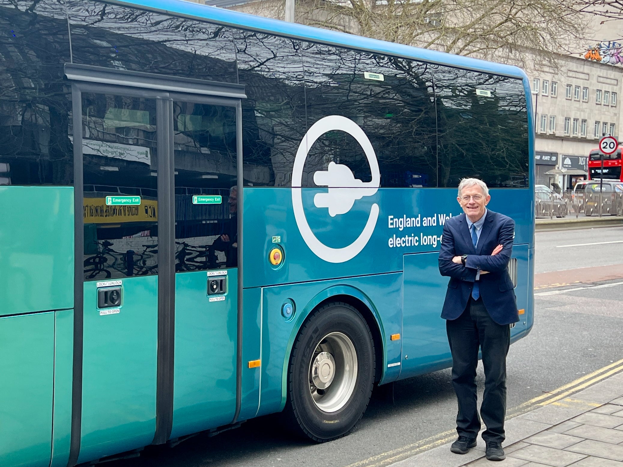 High energy: FlixBus electric coach, along with Simon Calder – thoughtfully wearing a matching tie