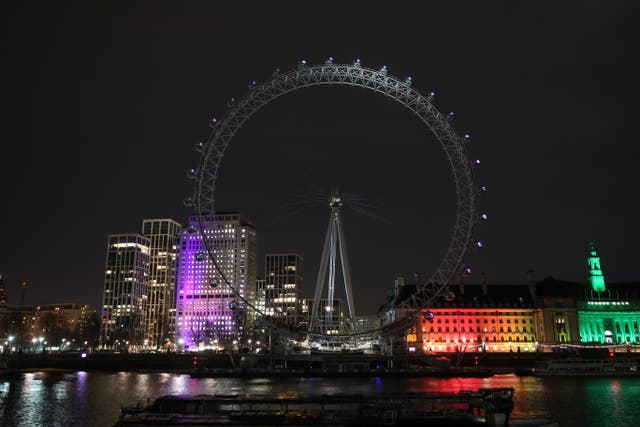 <p>The London Eye takes part in Earth Hour in 2021 as people across the world are encouraged to switch off their lights for an hour to show their support for the environment (Yui Mok/PA)</p>