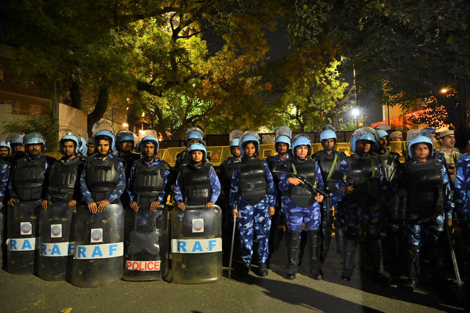 Indian Rapid Action force soldiers stand outside Aam Aadmi Party, or Common Man's Party, leader Arvind Kejriwal's residence