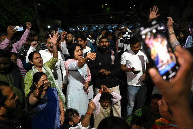 <p>Supporters of the Aam Aadmi Party shout slogans in front of the home of Aam Aadmi Party chief and Delhi Chief Minister Arvind Kejriwal after he was arrested on Thursday </p>
