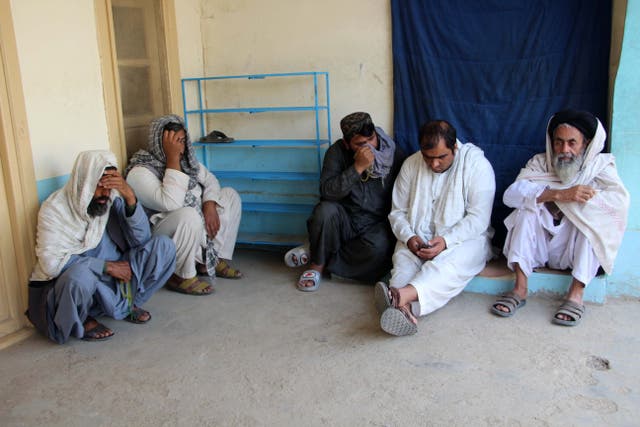 <p>Relatives attend the funeral of an Afghan man who was killed in a suicide attack at Kabul bank, in Kandahar</p>
