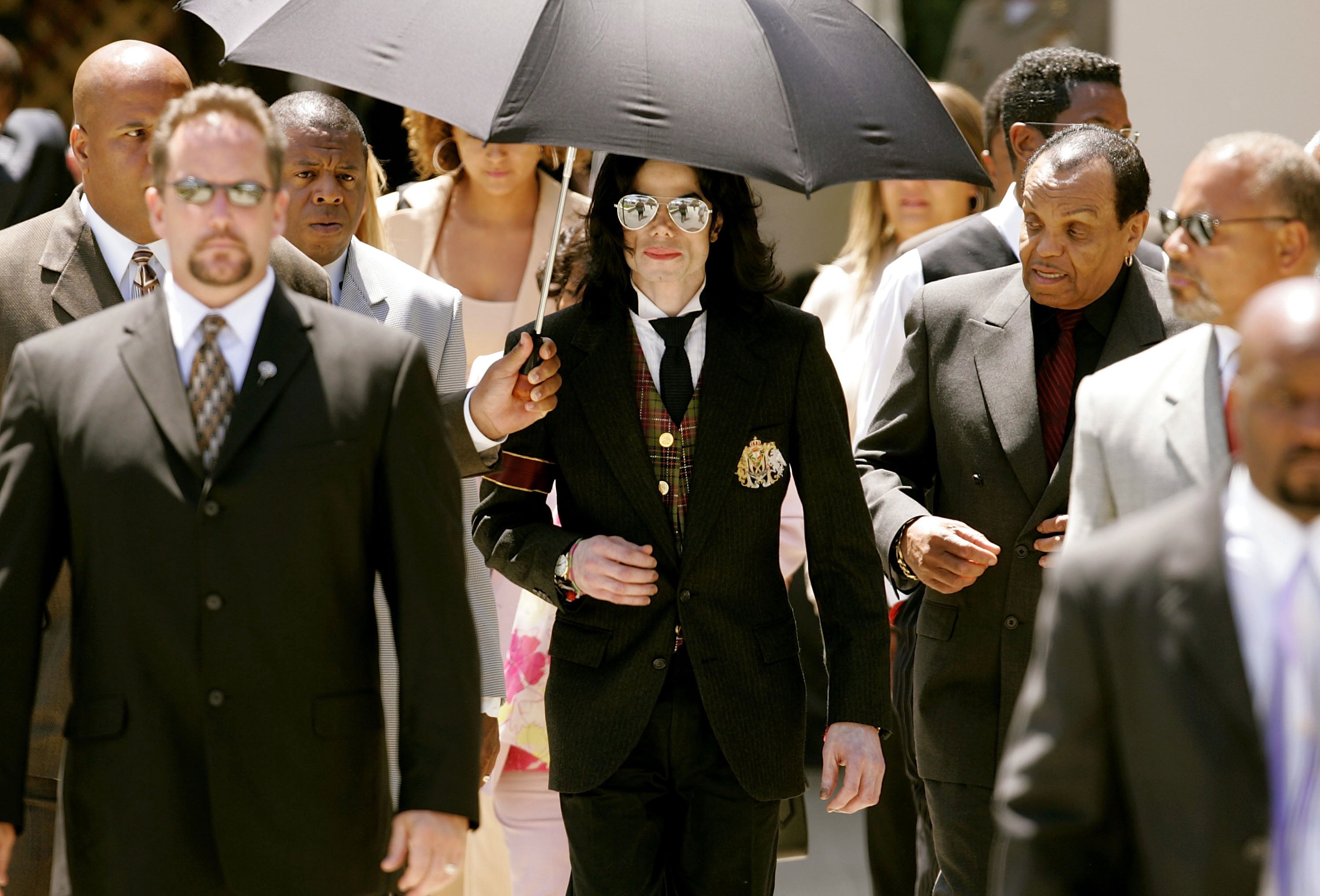 Jackson and his father Joseph leave the courthouse after listening to closing arguments in the singer’s child molestation trial, at the Santa Barbara County Courthouse on 2 June 2005