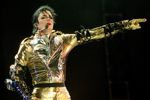 <p>Michael Jackson performs during his HIStory tour in 1996</p>