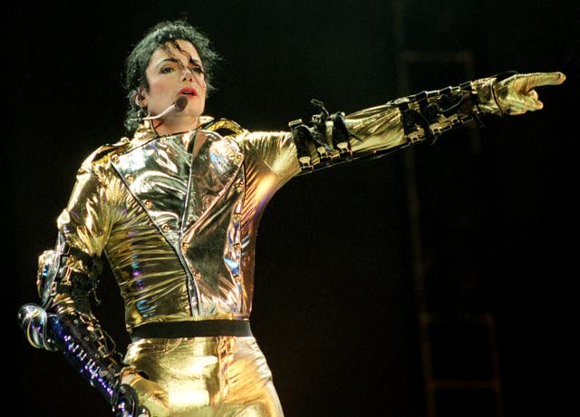 <p>Michael Jackson performs during his HIStory tour in 1996</p>