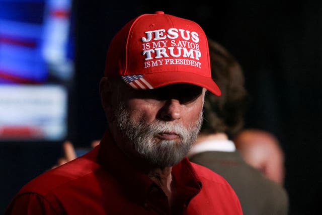 <p>A supporter of Republican presidential candidate and former US President Donald Trump attends his South Carolina Republican presidential primary election night party in Columbia, </p>